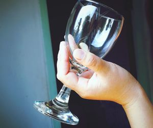 Close-up of hand holding wineglass