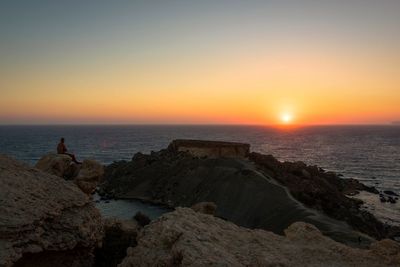 Scenic view of sea against sky during sunset