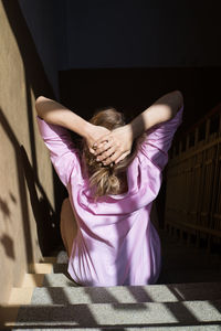 Young woman with pink hair