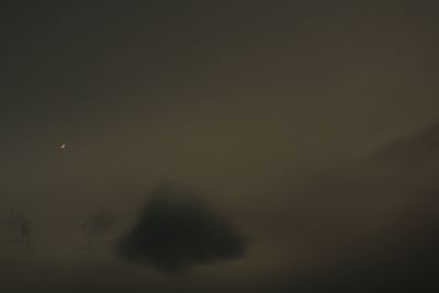 Low angle view of moon in sky at night