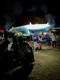 People on street in city at night