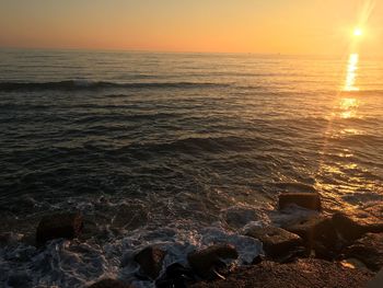 Scenic view of sea against sky during sunset