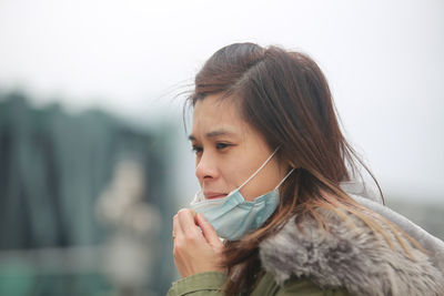 Close-up of woman wearing pollution mask