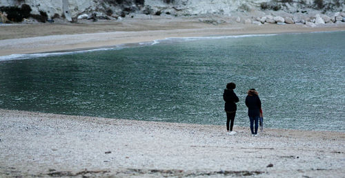 People walking on beach