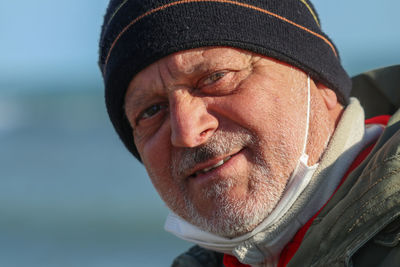 Close-up portrait of man wearing hat