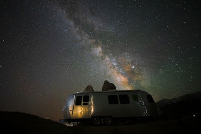 Low angle view of car on road at night