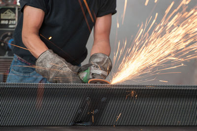 Man working on metal structure in factory