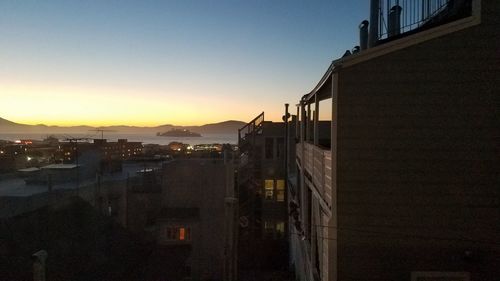 View of city against sky during sunset