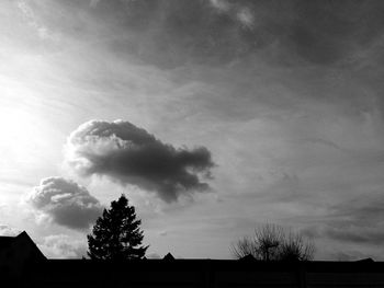 Low angle view of building against cloudy sky