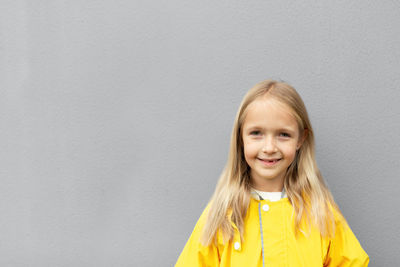 Kid in yellow raincoat  colors of the year 2021 ultimate gray and illuminating