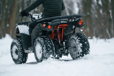 Close-up of car on snow covered field