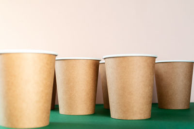 Close-up of drink on table against white background