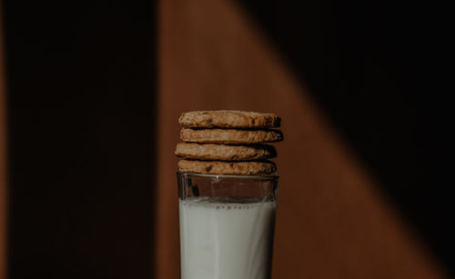Close-up of cookies in glass on table