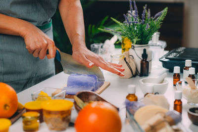 Homemade soap, cutting soap base at home.