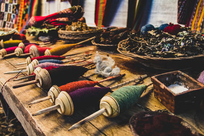 Close-up of spools on table