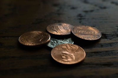 Close-up of coins on table