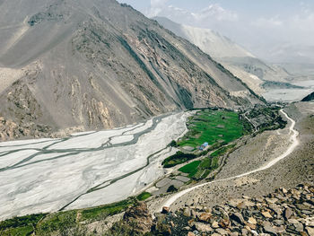 High angle view of snowcapped mountains against sky