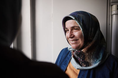 Smiling mature woman in headscarf