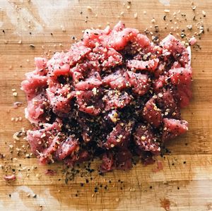 High angle view of strawberries on cutting board