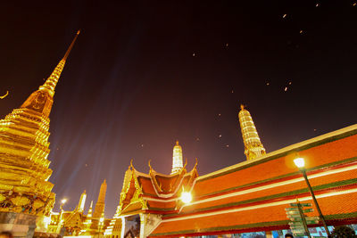 Low angle view of illuminated statue at night