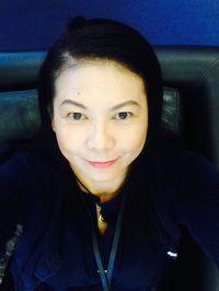 Close-up portrait of a smiling young woman