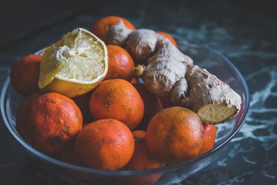 Close-up of fruits in container on table