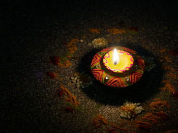 High angle view of illuminated candles on wall