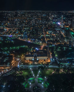 High angle view of illuminated buildings in city at night