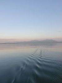 Scenic view of sea against clear sky during sunset