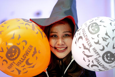 Close-up portrait of smiling young woman