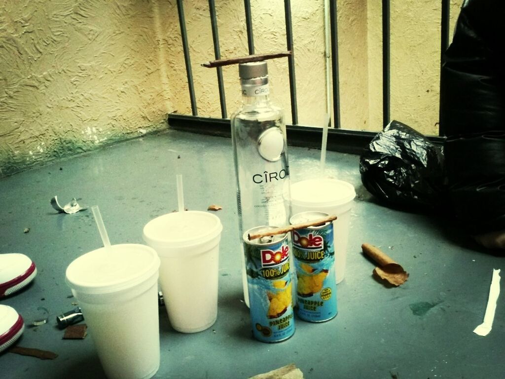 indoors, drink, food and drink, table, coffee cup, still life, refreshment, freshness, container, bottle, cup, no people, high angle view, coffee - drink, home interior, jar, day, variation, messy, food