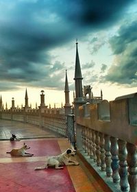 Buildings against cloudy sky