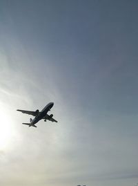 Low angle view of helicopter flying in sky