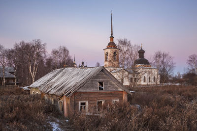 Historic buildings against sky during sunset