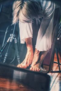 Side view of woman standing in music concert