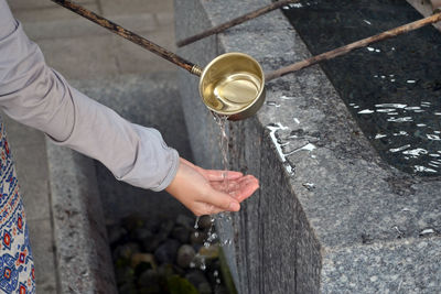 Midsection of woman washing hands