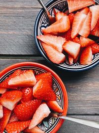 High angle view of chopped fruits in bowl on table