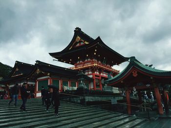 Low angle view of temple against cloudy sky