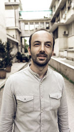 Portrait of young man standing outdoors