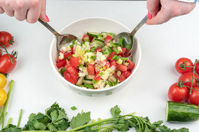 Cropped hand of person preparing food