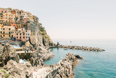 Panoramic view of sea and buildings against sky