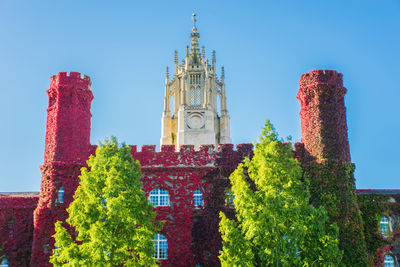 Low angle view of church against blue sky