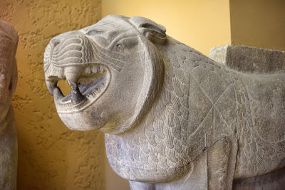 Close-up of elephant statue against wall