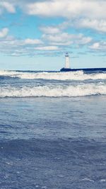 Scenic view of sea against cloudy sky