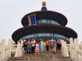 Group of people in front of historical building