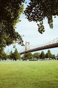 View of bridge on field against sky