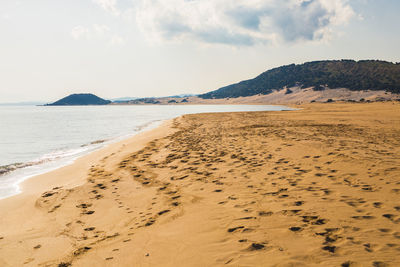 Scenic view of beach against sky