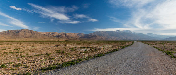 Road amidst landscape against sky