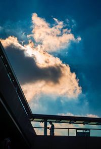 Low angle view of silhouette bridge against sky