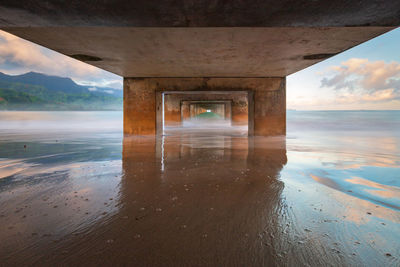 Underneath view of bridge over sea